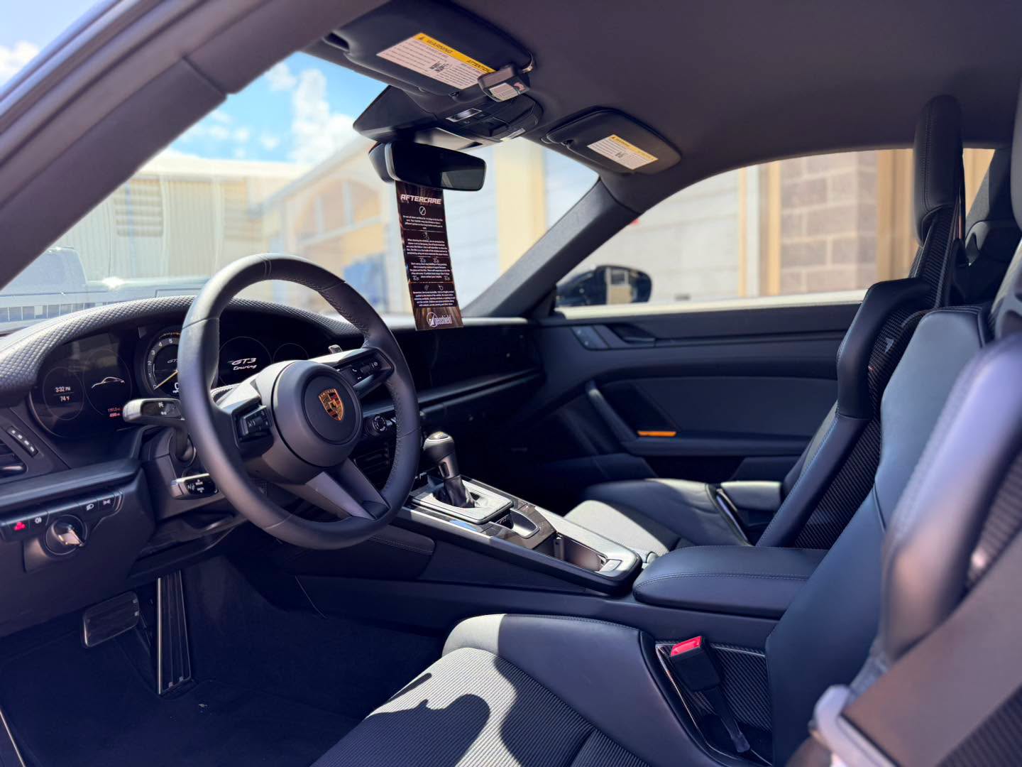 GT3 Touring cabin with the Geoshield aftercare tag on the mirror