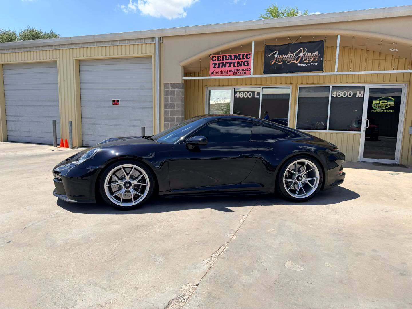 GT3 Touring side profile in front of the Luxury Kings storefront